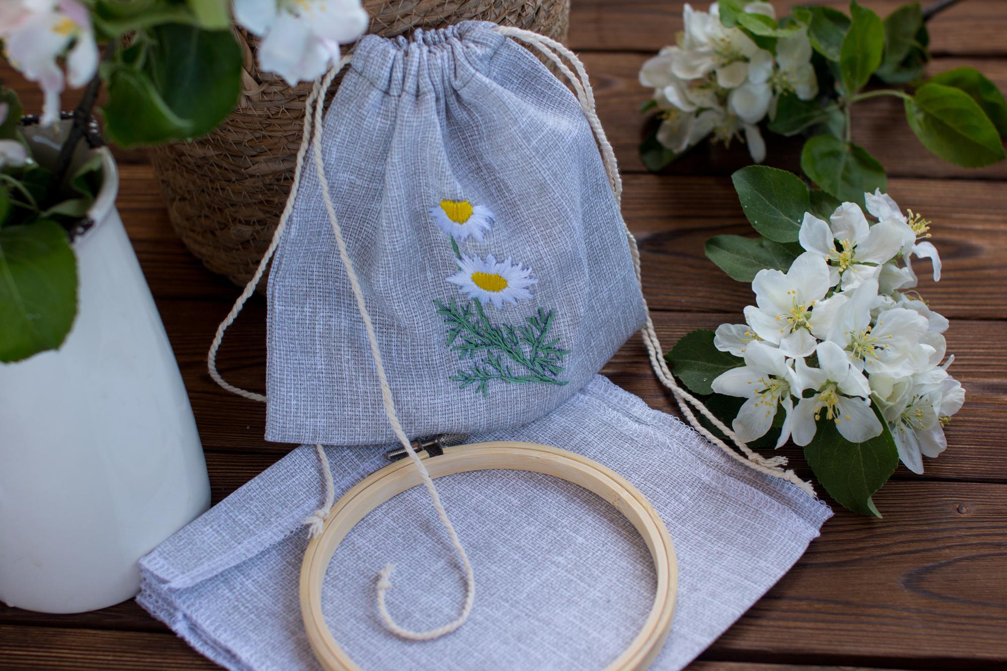 embroidered linen pouch with floral motif